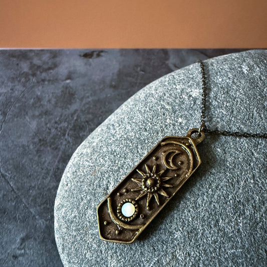 Decorative pendant necklace on a stone surface