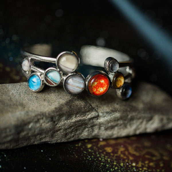 Bracelet with solar system planet images set in the silver setting.