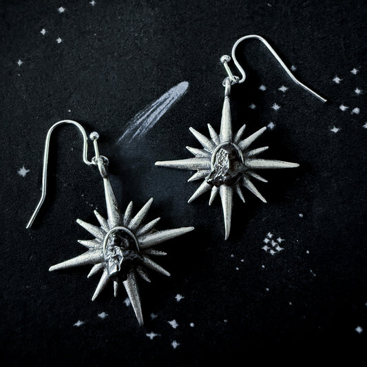 Supernova Starburst Dangle Earrings with Authentic Meteorite on a dark space background