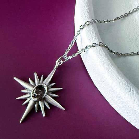 Supernova Starburst Necklace with Authentic Meteorite on a purple background