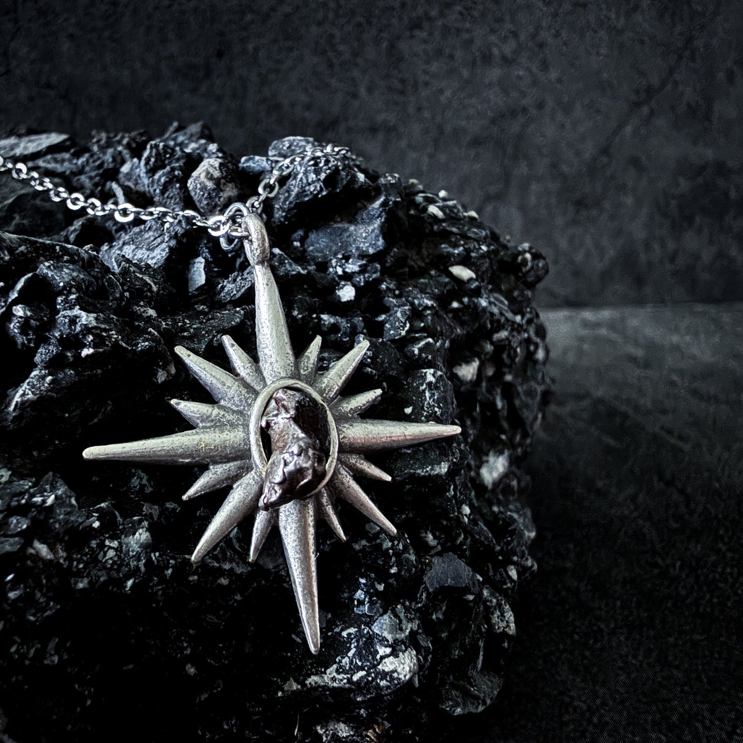 Necklace with a star-shaped pendant on a dark background