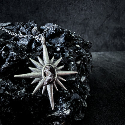 Necklace with a star-shaped pendant on a dark background
