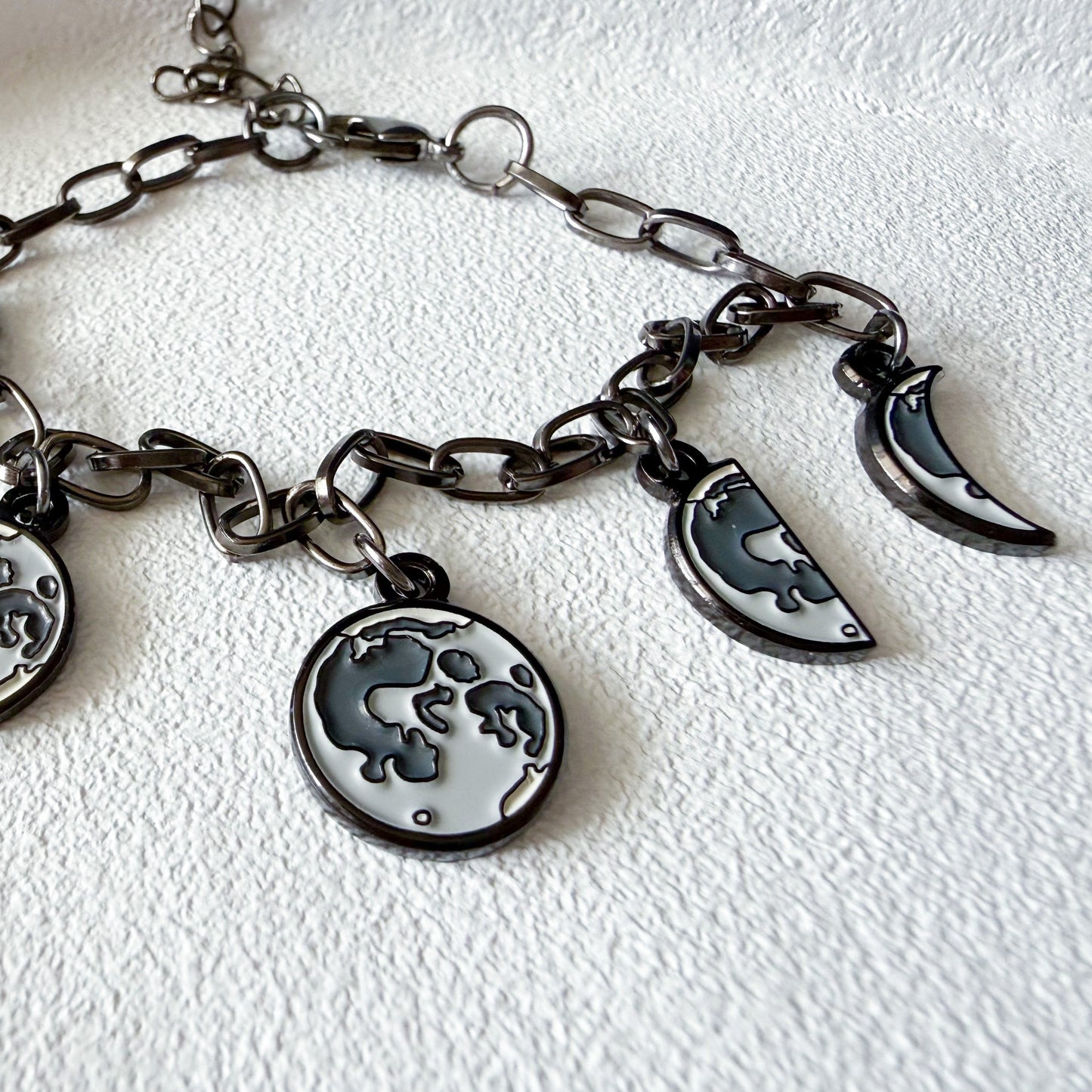 Bracelet with moon charms on a white background