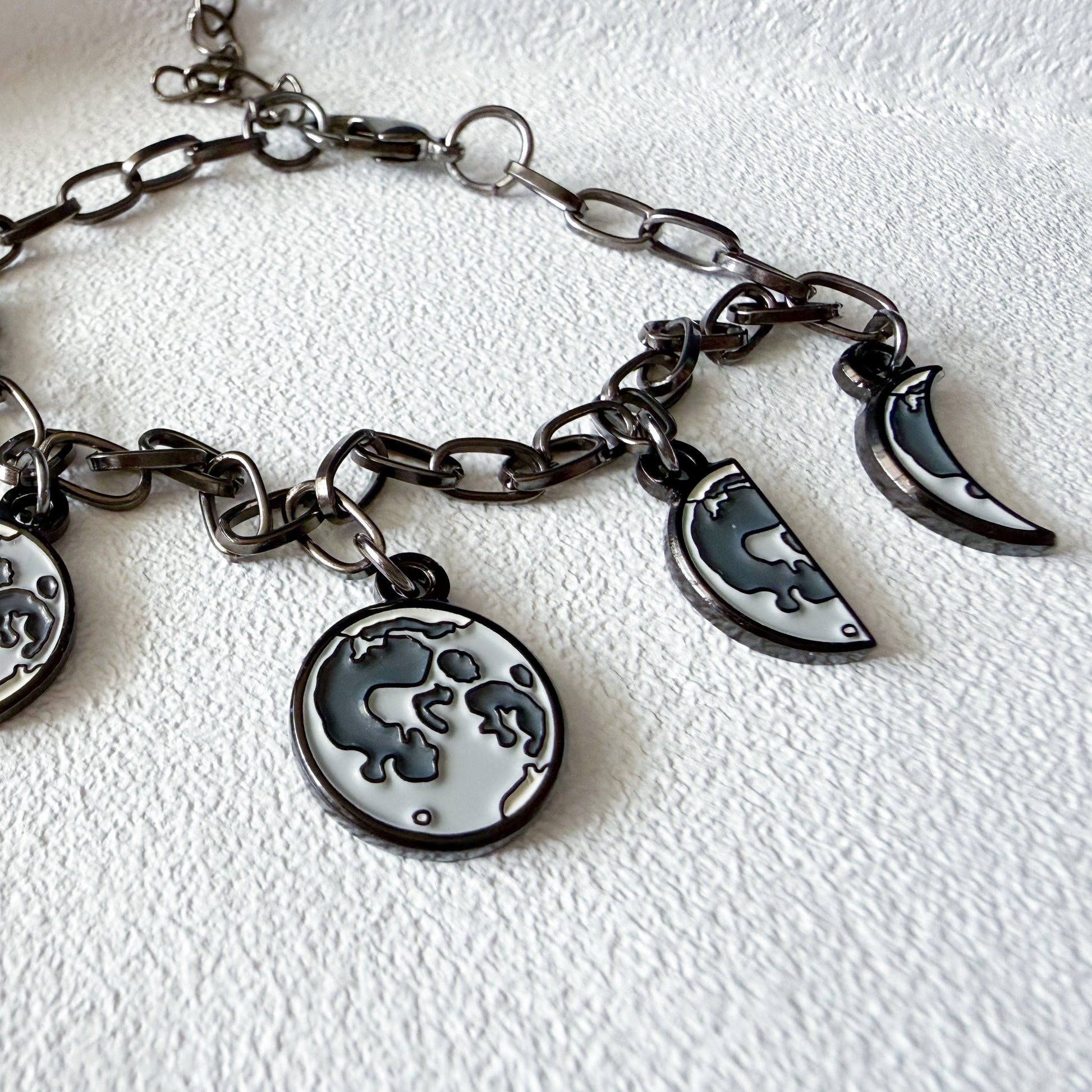 Bracelet with moon charms on a white background