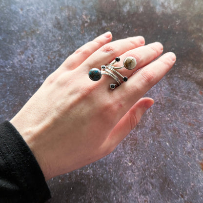 A hand wearing an Orbit Ring with Natural Stones Ring by Yugen Handmade   