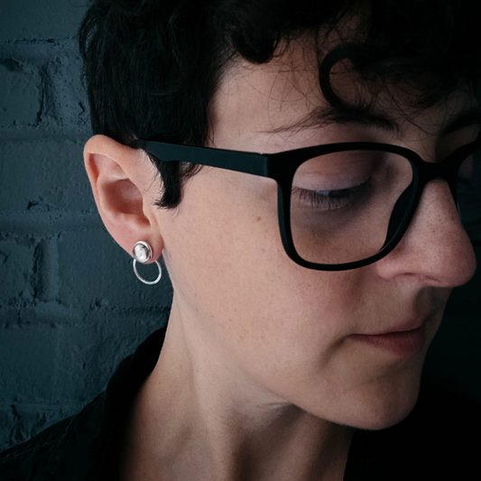 Circle Ear Jacket Earring on the ear of a womans head tilted to the side