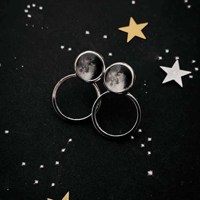 Circle Ear Jacket Earrings of a waning gibbous image on a dark starry background