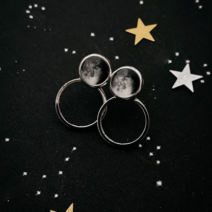 Circle Ear Jacket Earrings of a waning gibbous image on a dark starry background