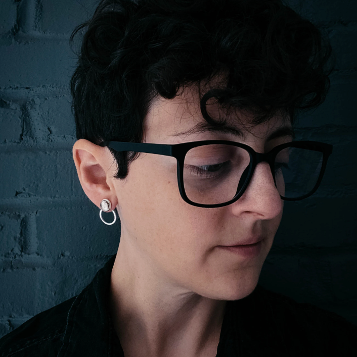 woman wearing a circle ear jacket earring