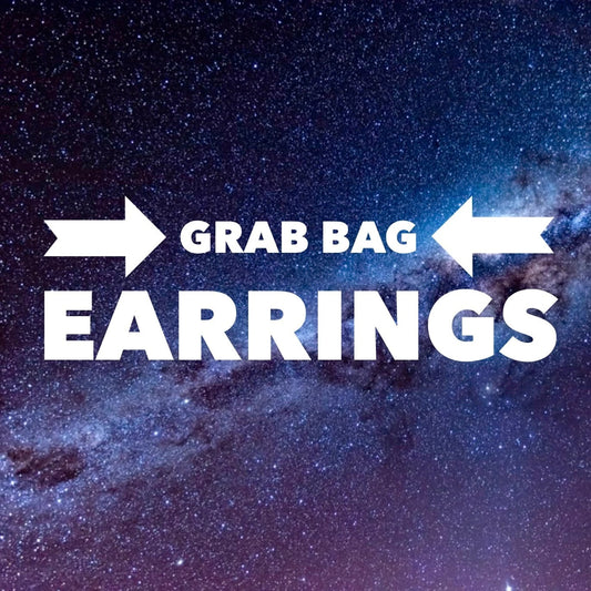 White text reading 'GRAB BAG EARRINGS' with arrow icons, centered over a starry galaxy background.
